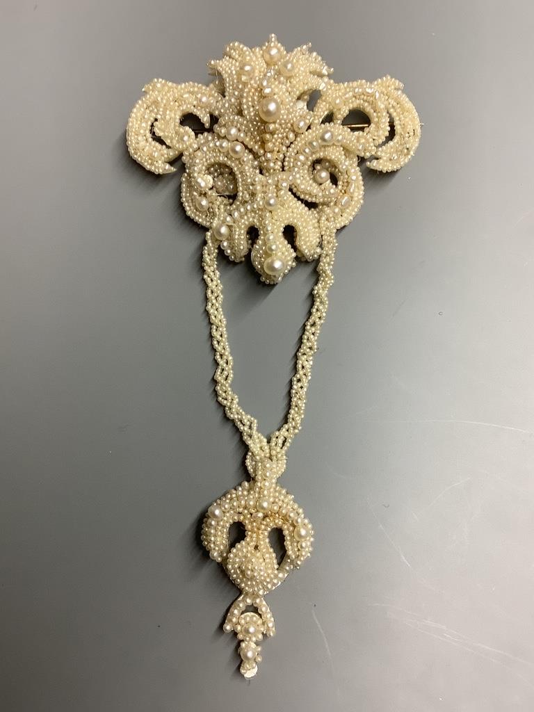 A 19th century seed pearl encrusted drop brooch in fitted box, 13.9 cm.